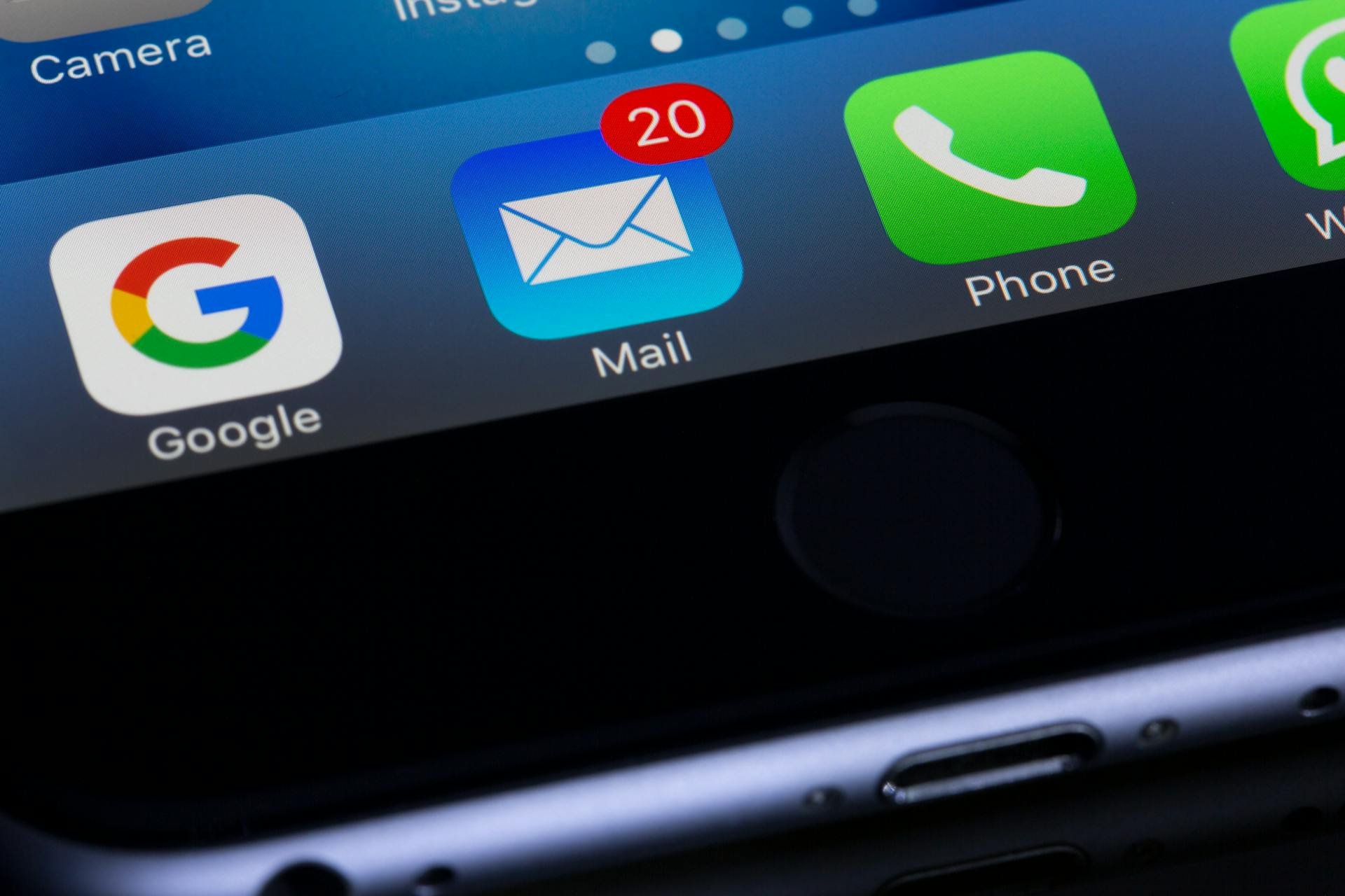 Smartphone screen showing app icons for Google, an email app with 20 new messages, and a phone app.