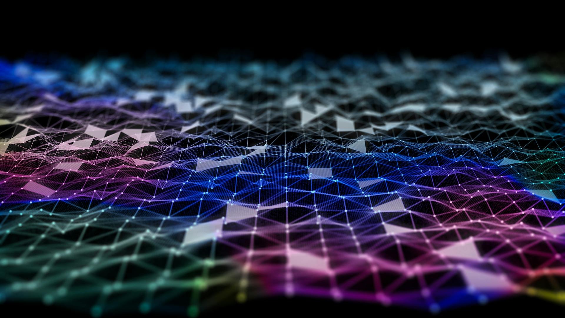 A digital representation of a network grid with interconnected nodes and lines, featuring a multicolored, low-poly, wireframe landscape.